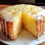 Moist pineapple juice cake with lime glaze dripping down the sides